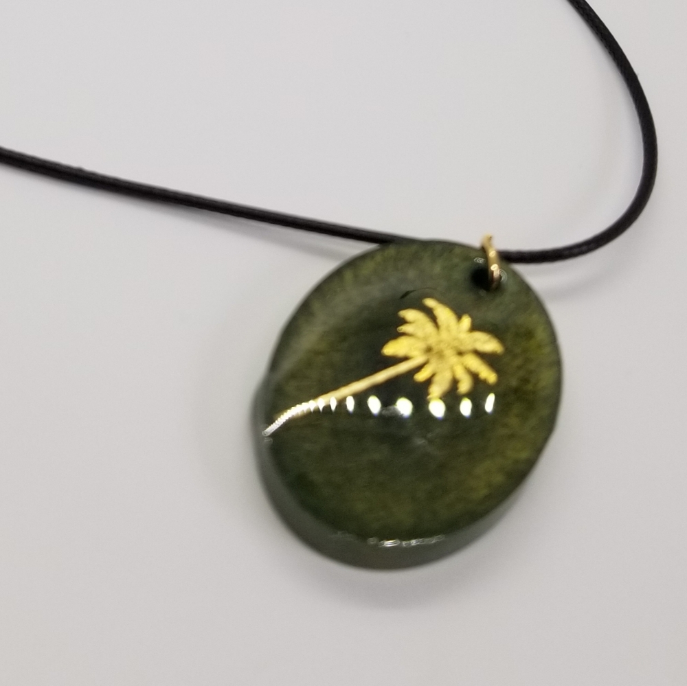 NWOT, handmade resin pendant and necklace cord, green with gold palm tree.